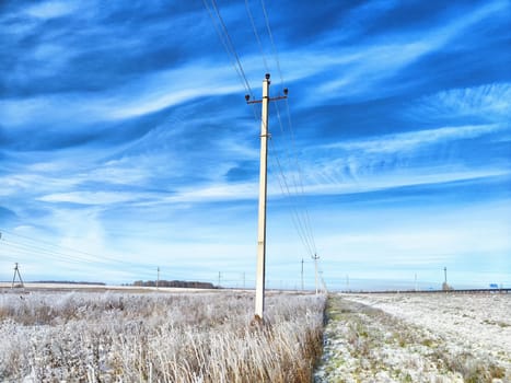 Old pole with wires against the sky. Electric transmission line, Eco-friendly energy