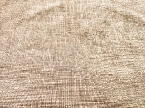 This neutral beige fabric features a subtle texture and pattern, providing an excellent backdrop for text or design elements.