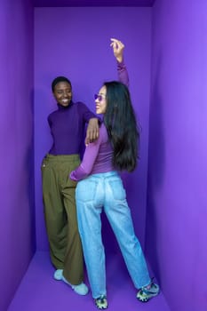 Trendy young adults confidently showcase their unique style amid a vibrant and colorful purple setting