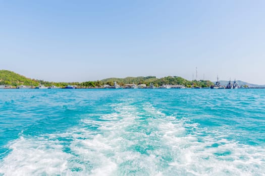 Tourist by sailing on turquoise ocean by ship with sun light in day time when vacation travel at sea for relax