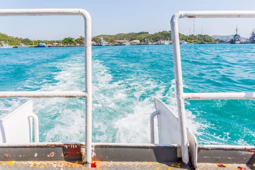 Tourist by sailing on turquoise ocean by ship with sun light in day time when vacation travel at sea for relax