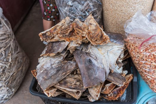 Salted fish (dried fish) is a dry food for sale at Thai street food market or restaurant in Thailand