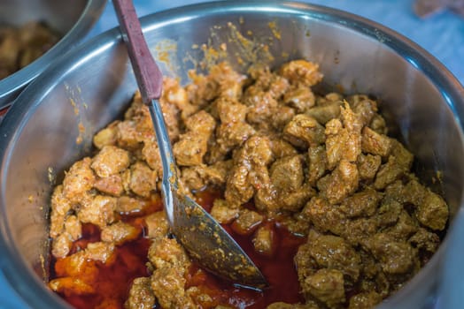 Hangle Curry, Northern Style Hang Lay Curry (Gaaeng Hang Laeh) for sale at Thai street food market or restaurant in Thailand