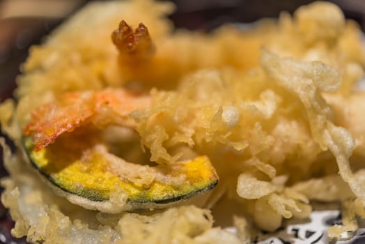 Tempura is a Japanese food usually consisting of seafood or vegetables for sale at Thai street food market or japanese restaurant in Thailand