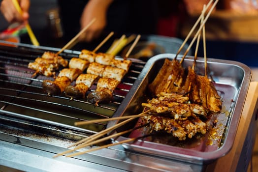 Mala is Grilled meat (Beef, Pork, Chickens or Mushroom) with chilli sauce and chinese hot spicy herb (Sichuan Pepper) for sale at Thai street food market or restaurant in Bangkok Thailand
