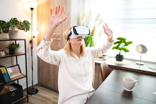 Enthusiastic user experiences virtual worlds while seated at a stylish desk.
