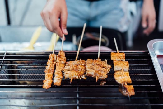 Mala is Grilled meat (Beef, Pork, Chickens or Mushroom) with chilli sauce and chinese hot spicy herb (Sichuan Pepper) for sale at Thai street food market or restaurant in Bangkok Thailand