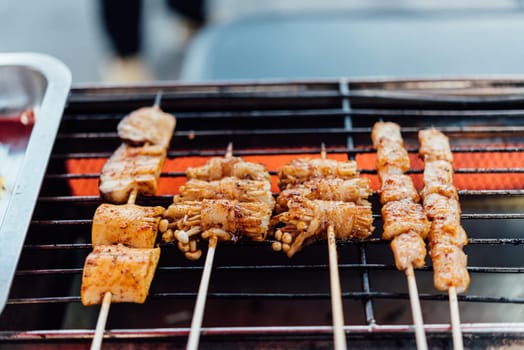 Mala is Grilled meat (Beef, Pork, Chickens or Mushroom) with chilli sauce and chinese hot spicy herb (Sichuan Pepper) for sale at Thai street food market or restaurant in Bangkok Thailand