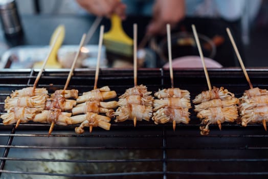 Mala is Grilled meat (Beef, Pork, Chickens or Mushroom) with chilli sauce and chinese hot spicy herb (Sichuan Pepper) for sale at Thai street food market or restaurant in Bangkok Thailand
