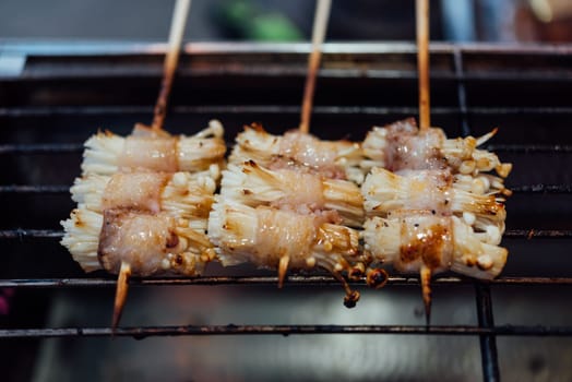 Mala is Grilled meat (Beef, Pork, Chickens or Mushroom) with chilli sauce and chinese hot spicy herb (Sichuan Pepper) for sale at Thai street food market or restaurant in Bangkok Thailand