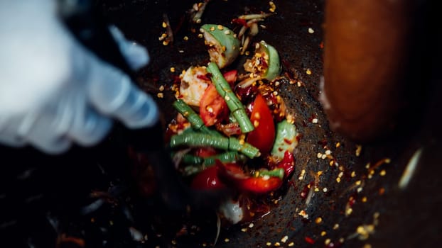 Papaya salad or Papaya Pok Pok (Som tum) for sale at Thai street food market or restaurant in Thailand