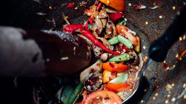 Papaya salad or Papaya Pok Pok (Som tum) for sale at Thai street food market or restaurant in Thailand