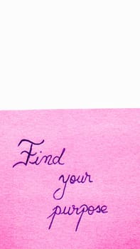 Find your purpose handwriting text close up isolated on pink paper with copy space. Writing text on memo post reminder