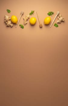 Composition with lemons, mint, ginger top view on simple beige background. Food for immunity stimulation and against seasonal flu. Healthy natural remedies to boost immune system.