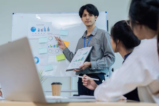 Business man present strategy plan on tablet to corporate colleagues in the office.