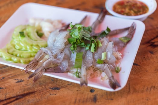 Shrimp in fish sauce premium grade is a seafood display for sale at Thai street food market or restaurant in Bangkok Thailand