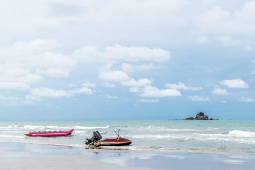 Travel in nature at a beach and tropical sea with blue sky and have a retro water scooter boat for adventure tourism with motor sport water