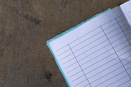 Vintage old Note book on a wood table