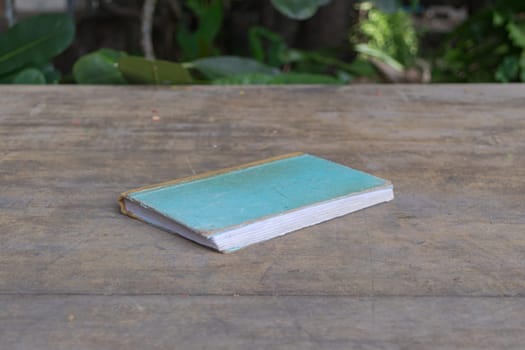 Vintage old Note book on a wood table