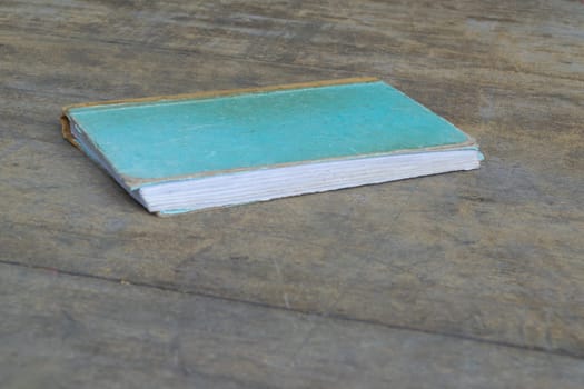 Vintage old Note book on a wood table