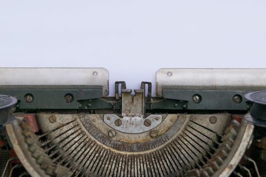 Vintage typewriter and a empty white paper