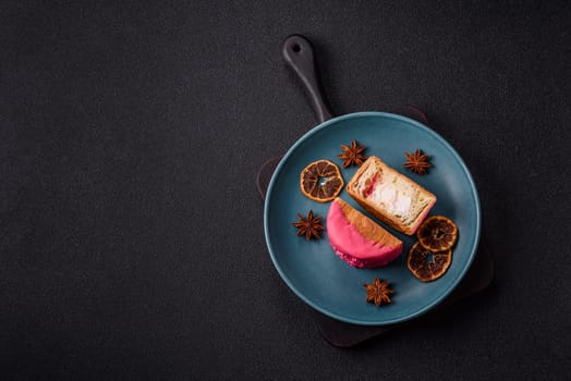 Round sweet New York roll croissant with raspberry cream filling on a dark concrete background