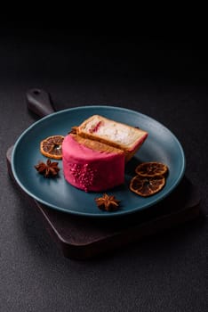 Round sweet New York roll croissant with raspberry cream filling on a dark concrete background