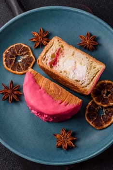 Round sweet New York roll croissant with raspberry cream filling on a dark concrete background