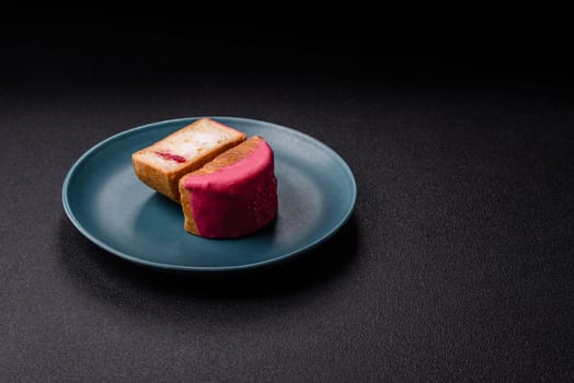 Round sweet New York roll croissant with raspberry cream filling on a dark concrete background