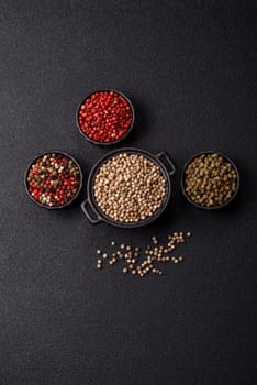 White allspice in a ceramic bowl on a dark concrete background