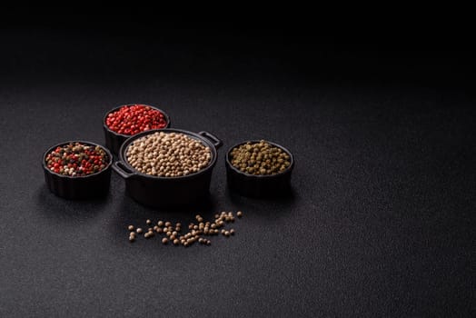 White allspice in a ceramic bowl on a dark concrete background