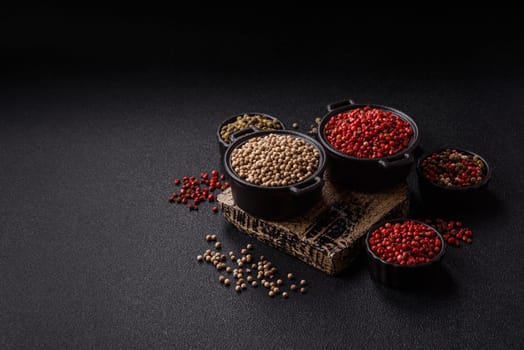 White allspice in a ceramic bowl on a dark concrete background