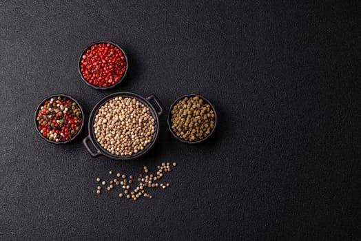 White allspice in a ceramic bowl on a dark concrete background