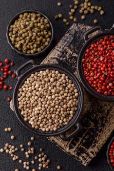 White allspice in a ceramic bowl on a dark concrete background