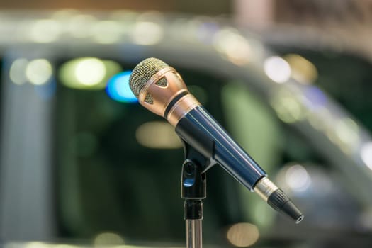 Microphone in seminar event or meeting room use mic for sound amplify when talk or communicate on stage defocus on meeting room background