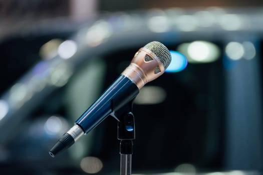 Microphone in seminar event or meeting room use mic for sound amplify when talk or communicate on stage defocus on meeting room background