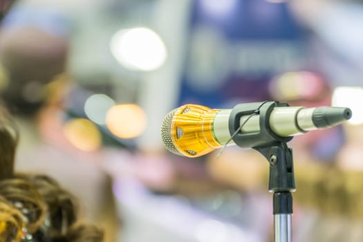 Microphone in seminar event or meeting room use mic for sound amplify when talk or communicate on stage defocus on meeting room background