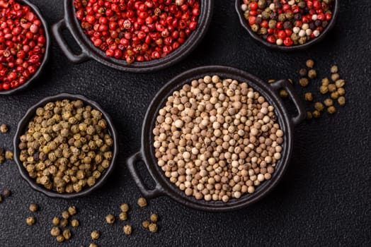 White allspice in a ceramic bowl on a dark concrete background