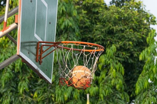 Basketball hoop make by wooden and ball in park