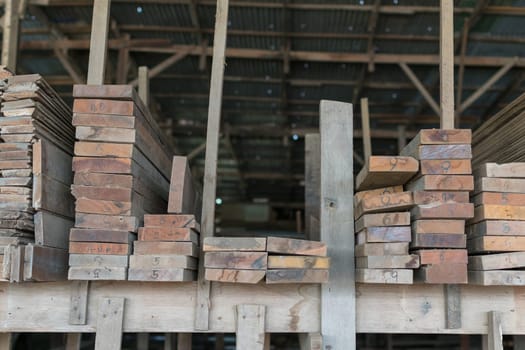 Slat and Timber wood from natural hardwood in warehouse for a construction