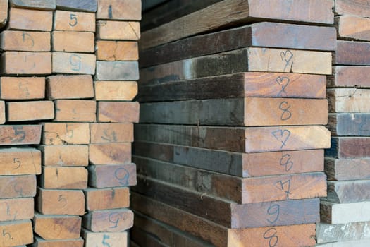 Slat and Timber wood from natural hardwood in warehouse for a construction