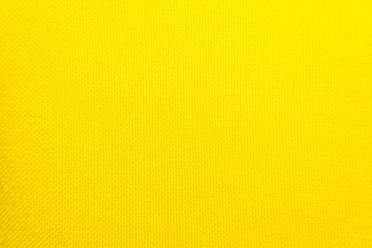 Macro of fabric weave texture surface yellow color use for background