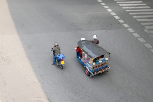 Thai TukTuk taxi parking in the row on the road in Bangkok, Thailand.