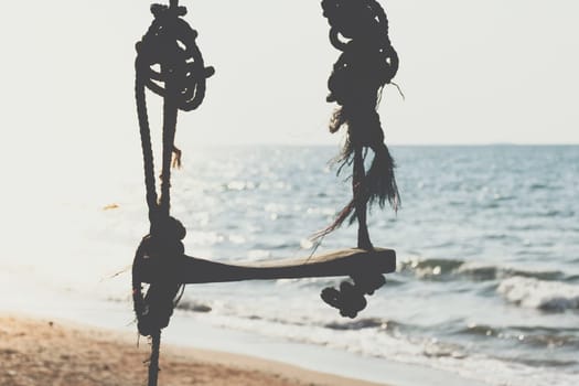 Landscape of travel place with nature at a beach and tropical sea with blue sky and have a outdoor swing use for relax in happy vacation