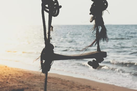 Landscape of travel place with nature at a beach and tropical sea with blue sky and have a outdoor swing use for relax in happy vacation