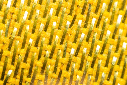 Macro of fabric weave texture surface yellow or orange color use for background
