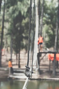 Asian people travel at adventure bases camp sky walker in Thailand