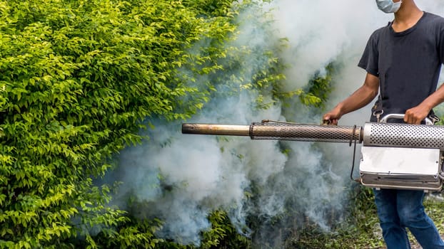 People fogging DDT spray kill mosquito for control Malaria, Encephalitis, Dengue and Zika in village at Bangkok Thailand.
