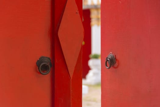 Buddhist temple gate with wooden door red color vintage style