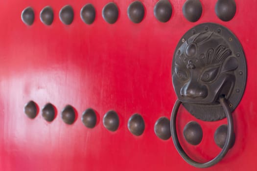 Buddhist temple gate with wooden door red color vintage style